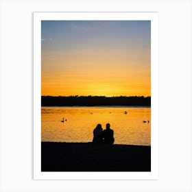 Beach At Sunrise Silhouetted Figure Meditating By The Shore Warm Glow Of Morning Light Reflecting Art Print