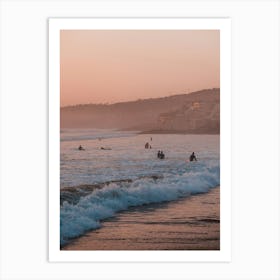 Surfers during sunset in the surftown of Taghazout, Morocco Art Print