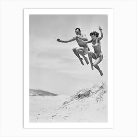 Couple Jumping In The Sand, Vintage Black and White Old Photo Art Print