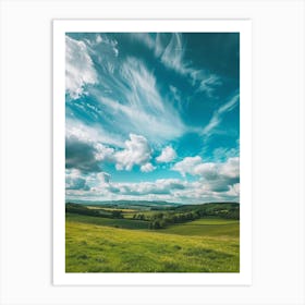 Cloudy Sky Over A Green Field Art Print