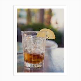 Glass With Cola And Ice And Lemon On A Table Outside Art Print