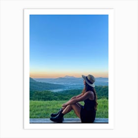 Woman Exuding A Sense Of Freedom While Sitting On A Wooden Porch Overlooking A Vast Hill And Sky Th (3) Art Print