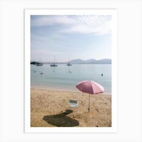 Pink Umbrella On The Beach Art Print