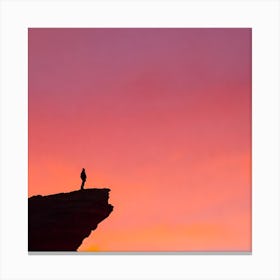 Silhouette Of A Man Standing On A Cliff Canvas Print