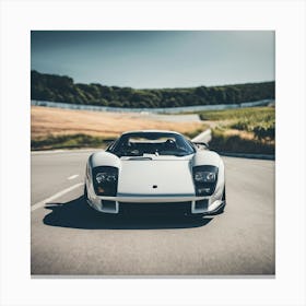 White Sports Car Driving Down A Road Canvas Print