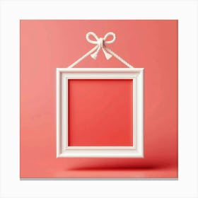White Frame With Bow On Pink Background Canvas Print