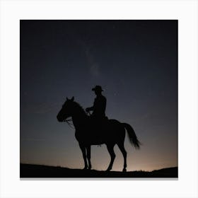 Silhouette Of Cowboy On Horseback At Night Canvas Print