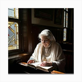 An Elderly Woman Of Faith Dressed In A White Cardigan Is Absorbed In Reading The Holy Bible Her H Canvas Print