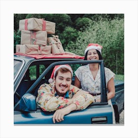 Couple In Santa Hats Canvas Print