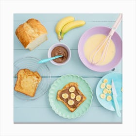 Breakfast with French toast with chocolate spread and banana shot from above Canvas Print