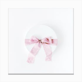 Pink Ribbon On A White Plate Canvas Print