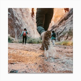 People Walking Through A Canyon Canvas Print