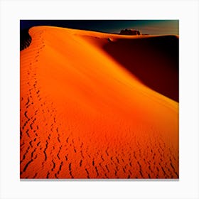 A Windswept Desert Dune Its Ridges Casting Dramatic Shadows In The Fiery Setting Sun Canvas Print