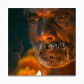 Man Lights A Candle Canvas Print