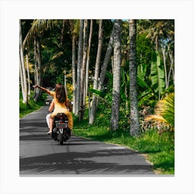 Couple Riding A Motorcycle Down A Road Canvas Print