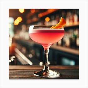 A beautiful, refreshing, and delicious pink cocktail with an orange twist, sitting on a bar, ready to be enjoyed. Canvas Print