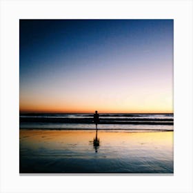 Person Standing On The Beach At Sunset Canvas Print