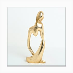 Gold Sculpture Of A Woman Canvas Print