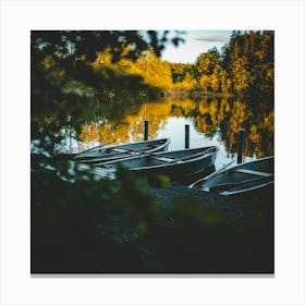 Canoes on a lake Canvas Print