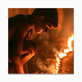 Boy Lighting A Fire Canvas Print