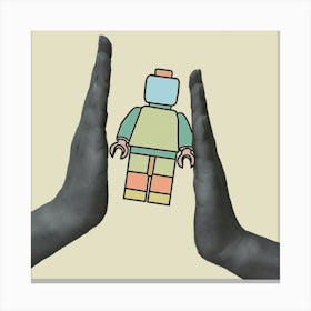 Two Hands Holding A Lego Figure Canvas Print