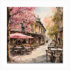 watercolor painting of a cafe with tables and chairs outside of it and a tree with pink flowers on it Canvas Print