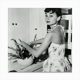 Audrey Hepburn Arranging Flowers In Kitchen Canvas Print