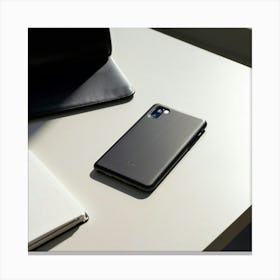 Leather Phone Case Rests On A White Table Paired With A Notebook And Ballpoint Pen In A Minimalist Canvas Print