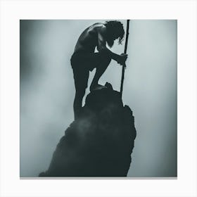 Silhouette Of A Man Climbing A Mountain Canvas Print