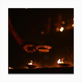 Man Lighting A Candle Canvas Print