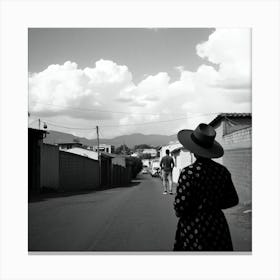 Woman Walks Down A Street Canvas Print