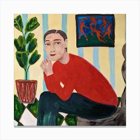 A woman with a plant in a pot on a painting by Matisse in the background Canvas Print