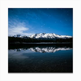 Snow Capped Mountains Rising Majestically From A Tranquil Reflection Mirror Lake In The Foreground Canvas Print