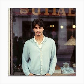 Young Spanish Man Posing In Front Of A Blurry Shop Window Captured With A Retro And Nostalgic Mood Canvas Print