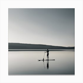 Silhouette Of A Paddle Boarder On A Lake Canvas Print