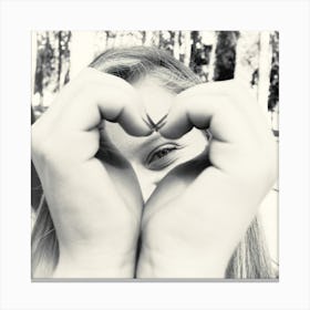 Woman Peeking Through A Heart Shape She Does With Her Hands 1 Canvas Print