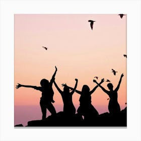 Silhouette Of Friends At Sunset Canvas Print