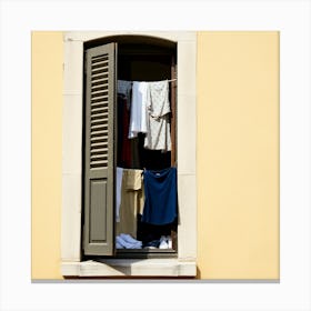 Clothes Hanging In A Window Canvas Print