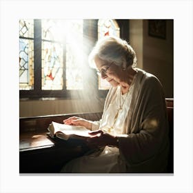 An Elderly Woman Of Faith Dressed In A White Cardigan Is Absorbed In Reading The Holy Bible Her H (5) Canvas Print