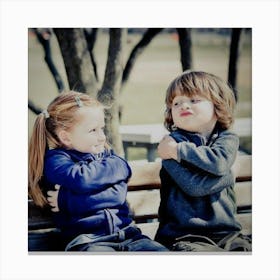 Two Kids Sitting On A Bench Canvas Print