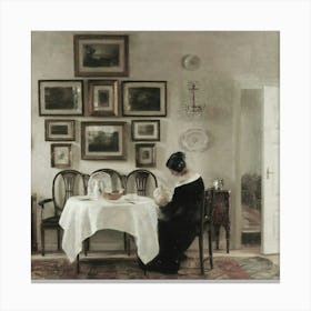 Woman At The Table Canvas Print