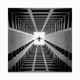 Airplane In The Sky,airplane flying over the buildings Canvas Print