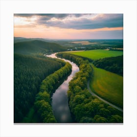 River Flowing Through Lush Green Landscape Canvas Print