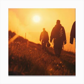 Silhouette Of Hikers At Sunset Canvas Print