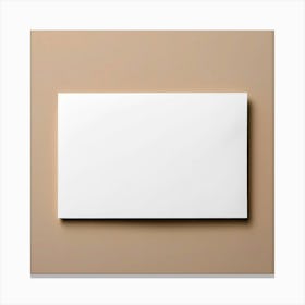 Blank White Card On A Beige Wall Canvas Print