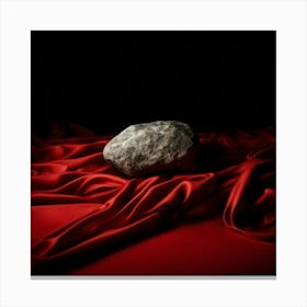 Rock On A Red Cloth Canvas Print