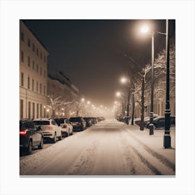 A Dimly Lit Snowy Street Lined With Parked Cars Has Buildings In The Background, Streetlights Providing Safety Amid The Peaceful White Surroundings Canvas Print