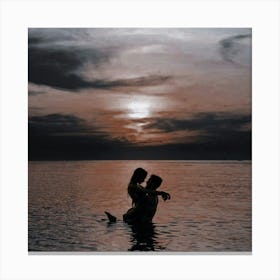 Couple In Water At Sunset Canvas Print