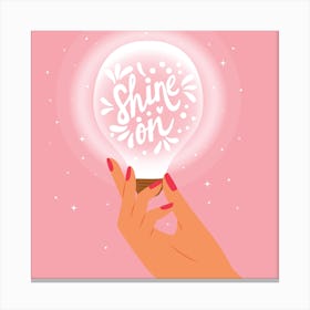 Shine On Hand Lettering With Hand Holding A Light Bulb On Pink Square Canvas Print