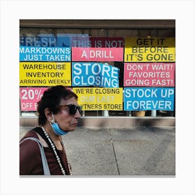 Woman Walks Past A Storefront Sign Canvas Print